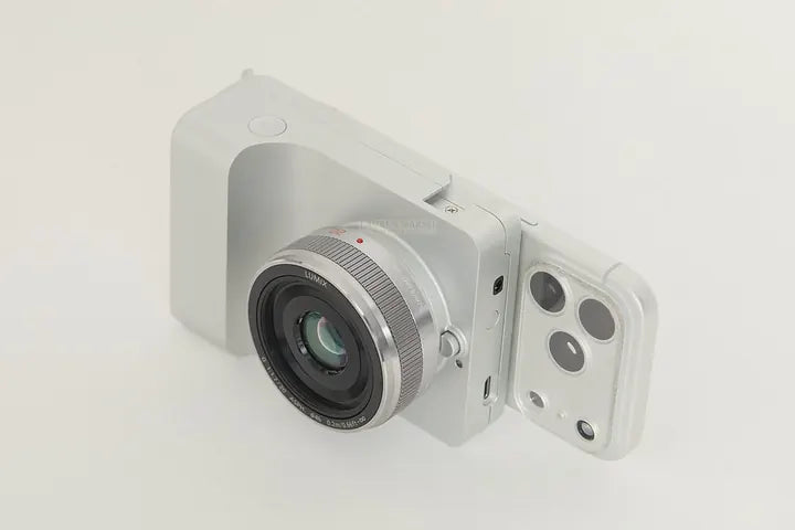 Caira silver with iPhone, three-quarter view