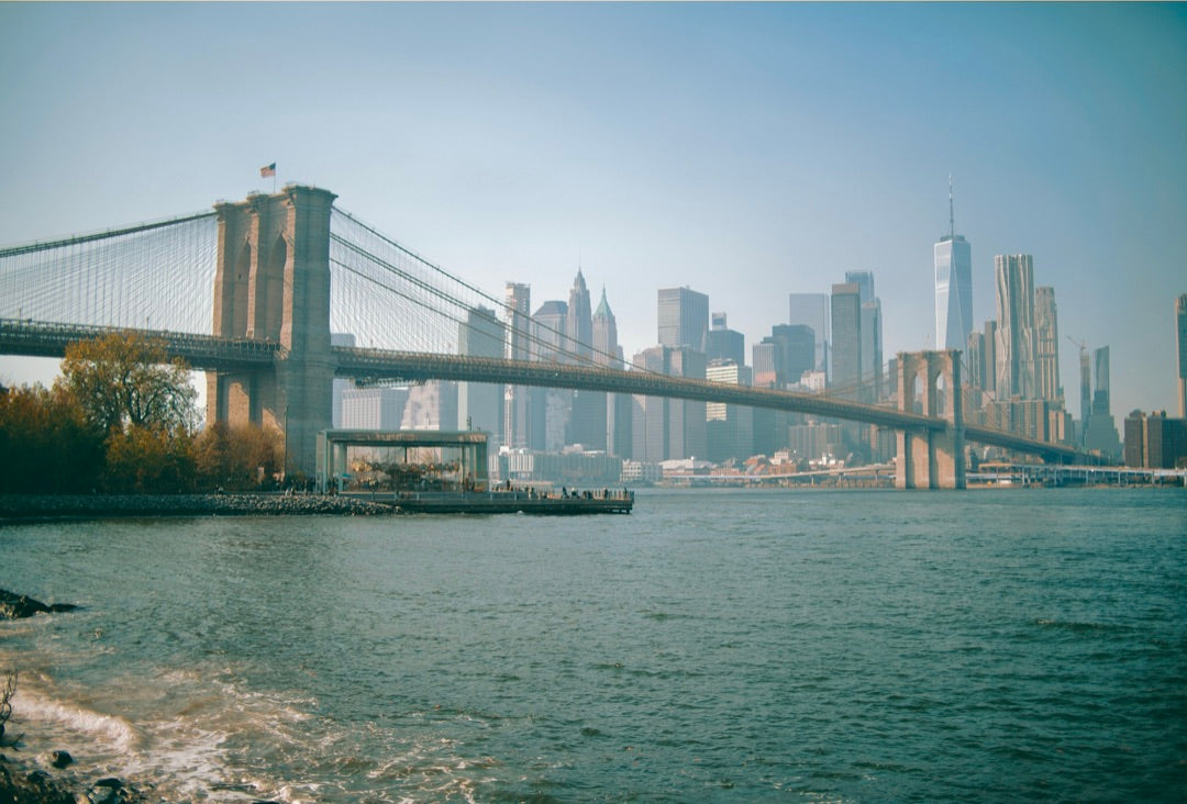 Brooklyn Bridge spanning the East River with lower Manhattan behind — captured with Caira