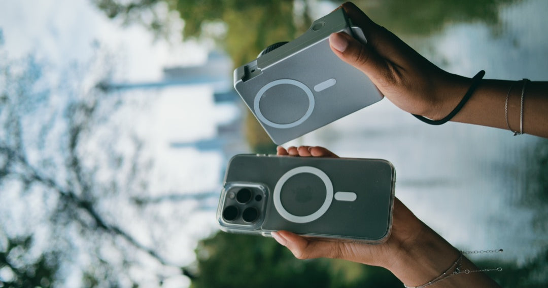 Two hands holding an iPhone and Caira showing both MagSafe rings