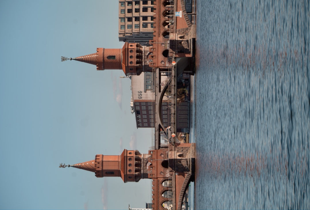 Twin brick towers of the Oberbaum Bridge over the Spree — captured with Caira