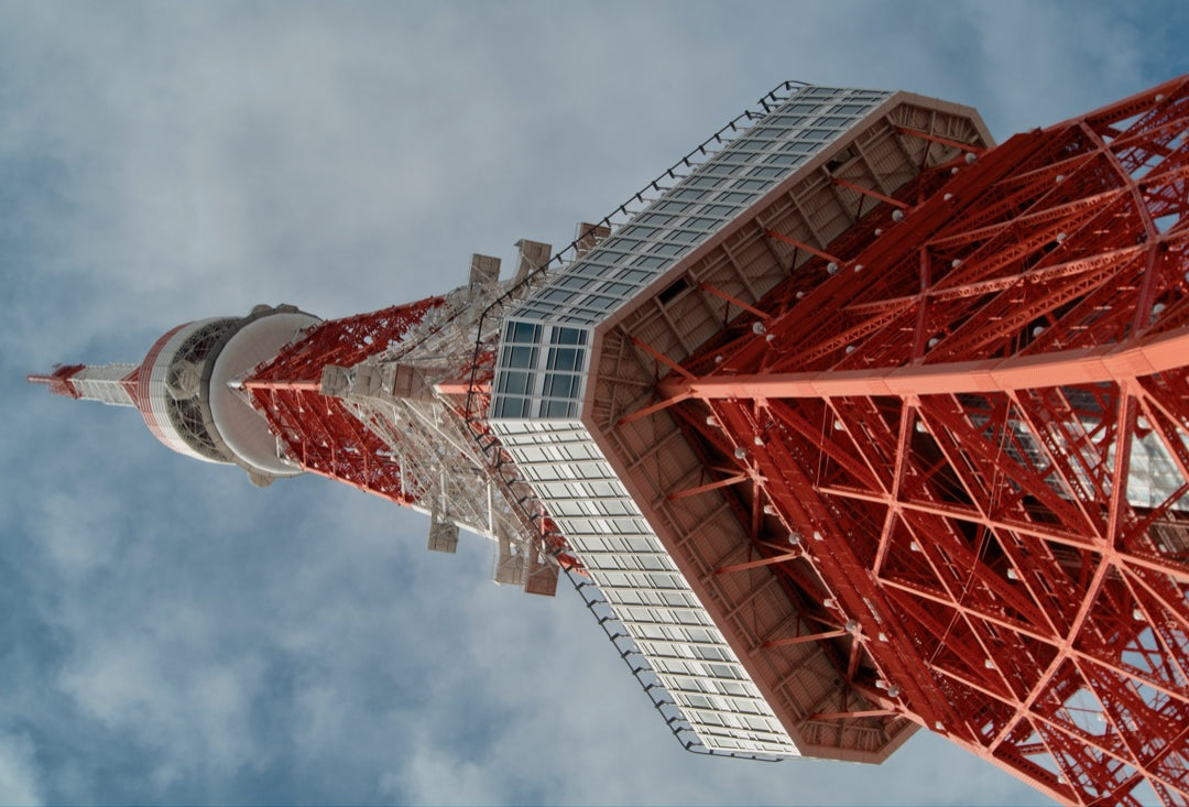 Tokyo Tower from below against a blue sky — captured with Caira