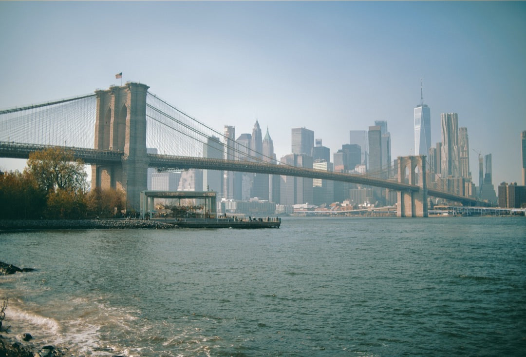 Brooklyn Bridge spanning the East River with lower Manhattan behind