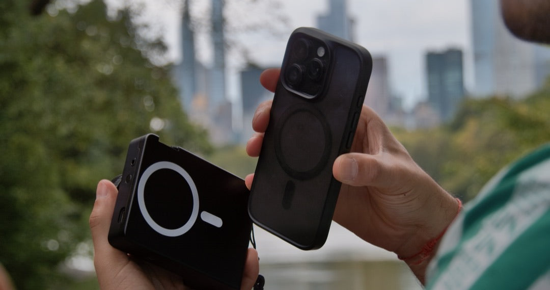 Hands about to snap Caira onto an iPhone over a Central Park lake