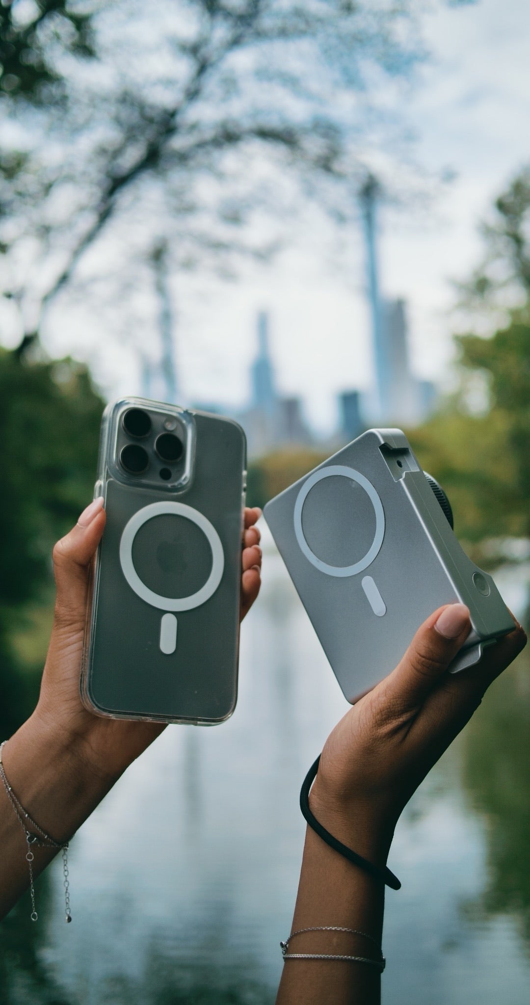 Two hands holding an iPhone and Caira showing both MagSafe rings