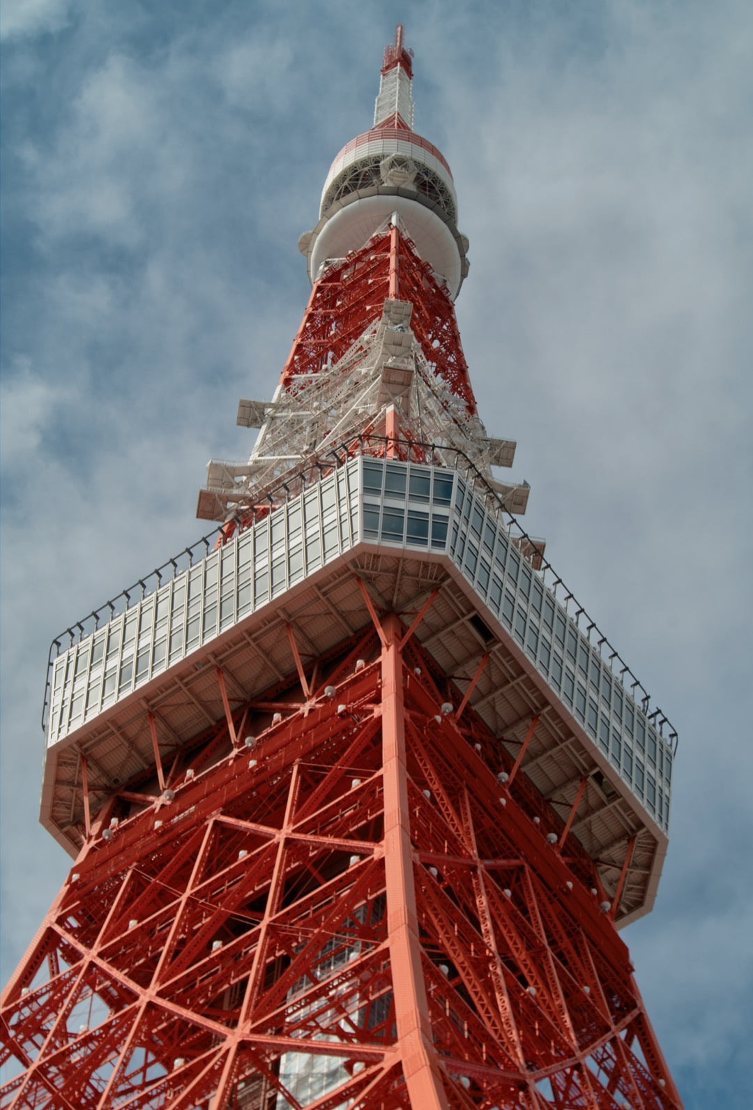 Tokyo Tower from below against a blue sky