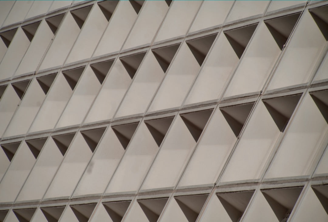 Repeating triangular window pattern on a modernist facade