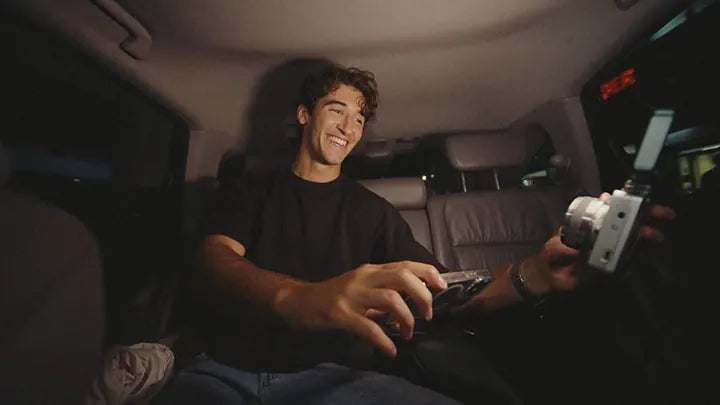 Creator in a car, Caira in hand