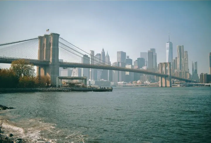 Brooklyn Bridge spanning the East River with lower Manhattan behind, captured with Caira