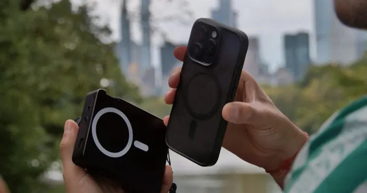 Hands about to snap Caira onto an iPhone over a Central Park lake