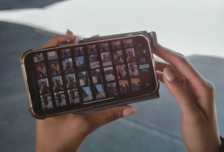 Hands holding the phone, style strip on screen