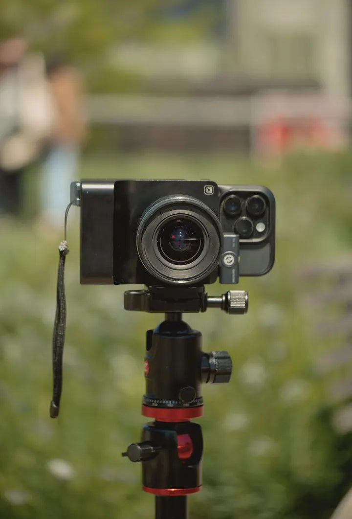 Caira on a tripod, creator a few steps away speaking to it · camera whole